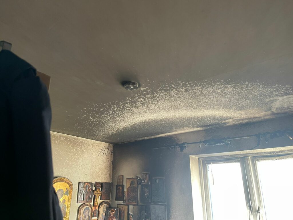 Smoke damage resulting in walls and ceiling covered in soot.