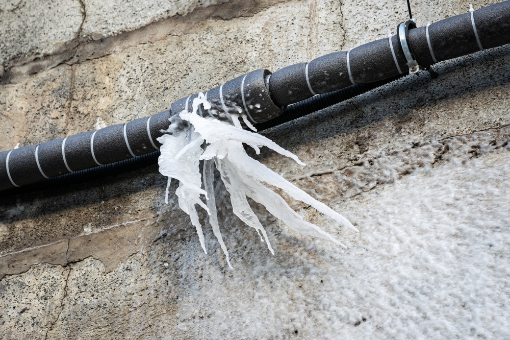 burst water pipe outside house